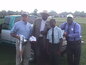 Cadet Watkins and some of the Jayem's Faculty.